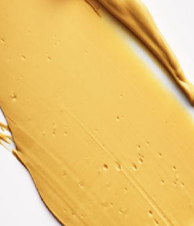 Close up of the turmeric_clay swatch on a white background