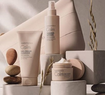 Cosmetic products including bottles and jars on a neutral background
